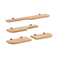 Set of four wooden shelves with black brackets on a white background