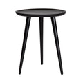 A black round side table with three legs.