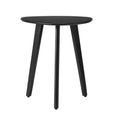 A small triangle top black side table with three legs.